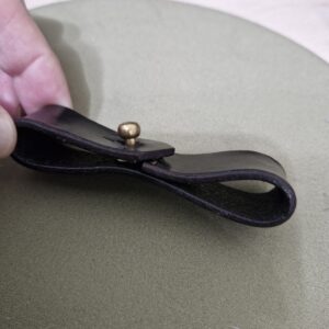 Leather breakaway with one loop that will attach permanently to the Lead rope spliced loop and one that opens to attach to the Halter
