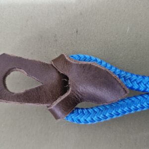 Piece of leather looped through the tie-loop on the Royal Blue rope Halter